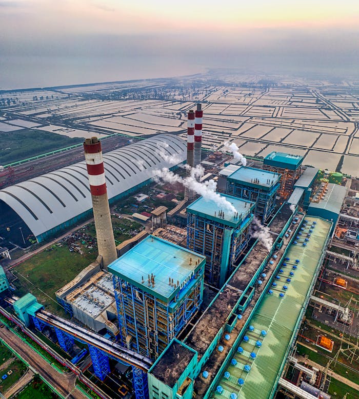 Aerial view of an industrial power plant with smokestacks in Banten, Indonesia.